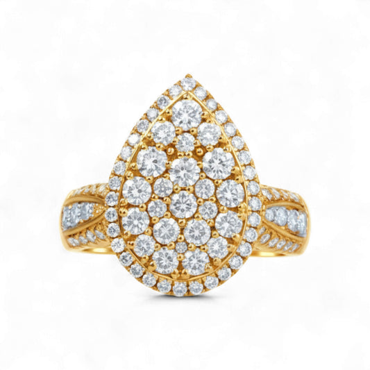 Gold ring with diamond teardrop design on a white background
