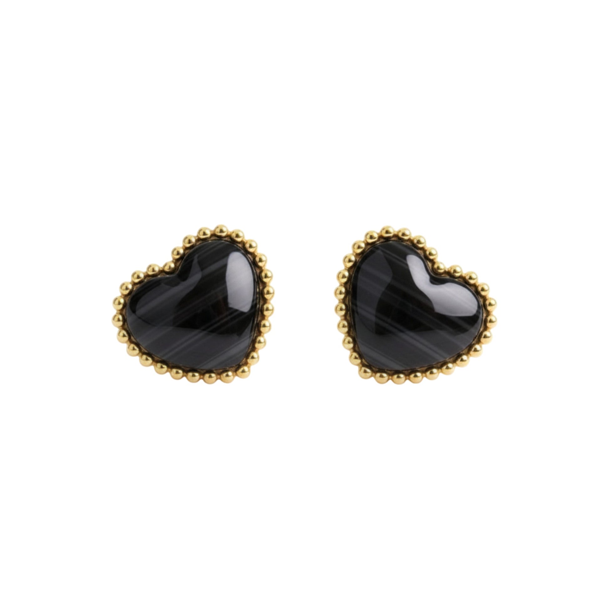 Heart-shaped black earrings with gold rims on a white background