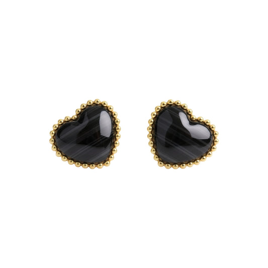 Heart-shaped black earrings with gold rims on a white background