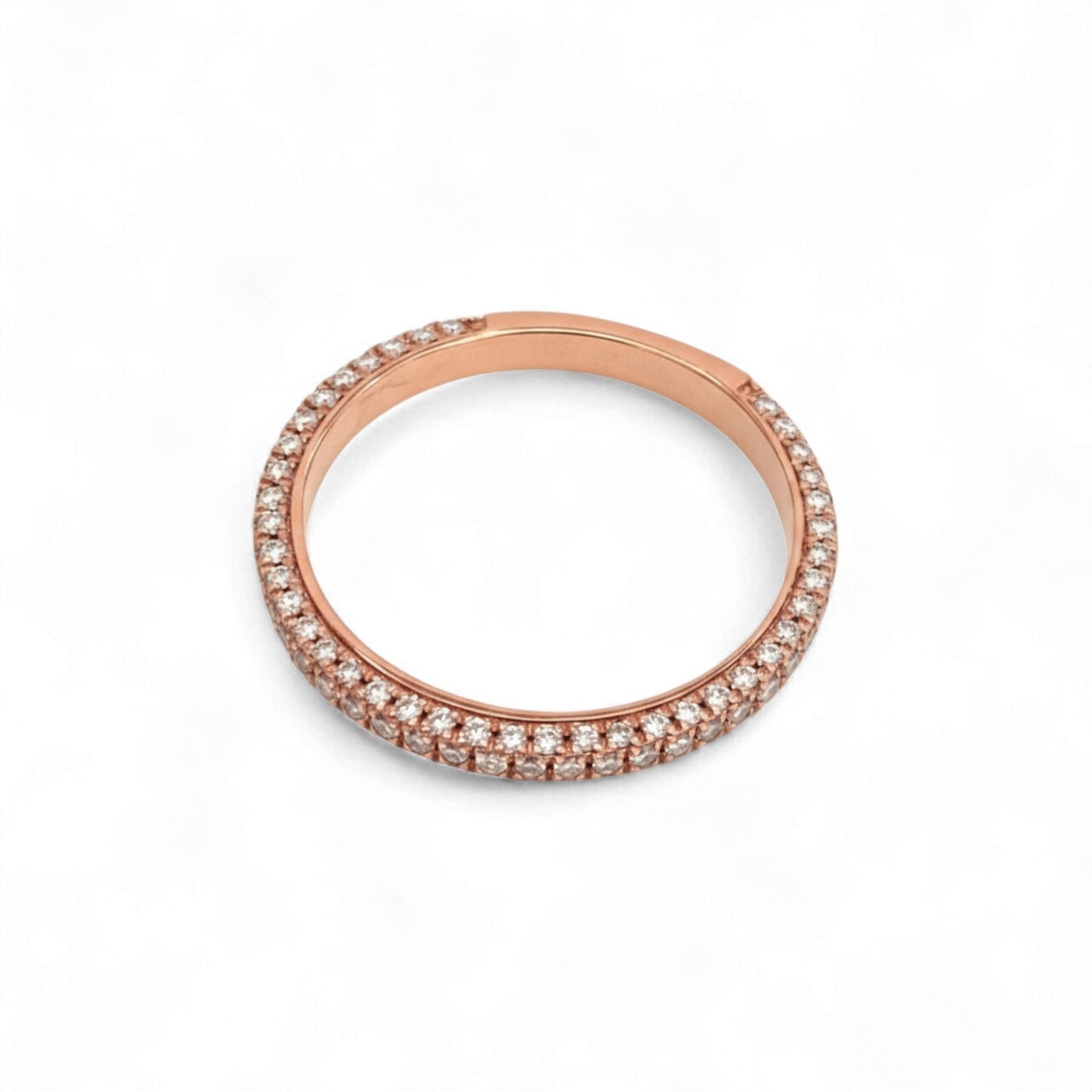 Rose gold ring with small diamonds on a white background