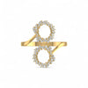 Gold ring with diamond accents on a white background