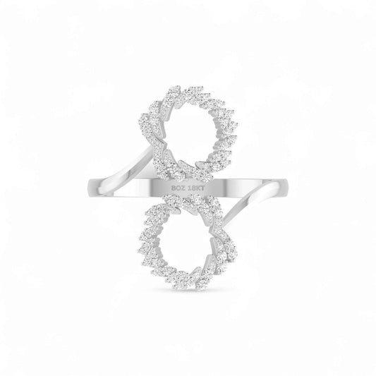 Silver ring with diamond accents on a white background