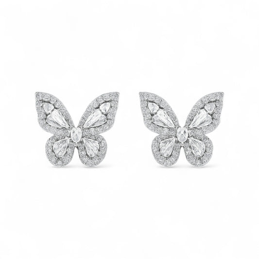 Butterfly-shaped earrings with gemstones on a white background