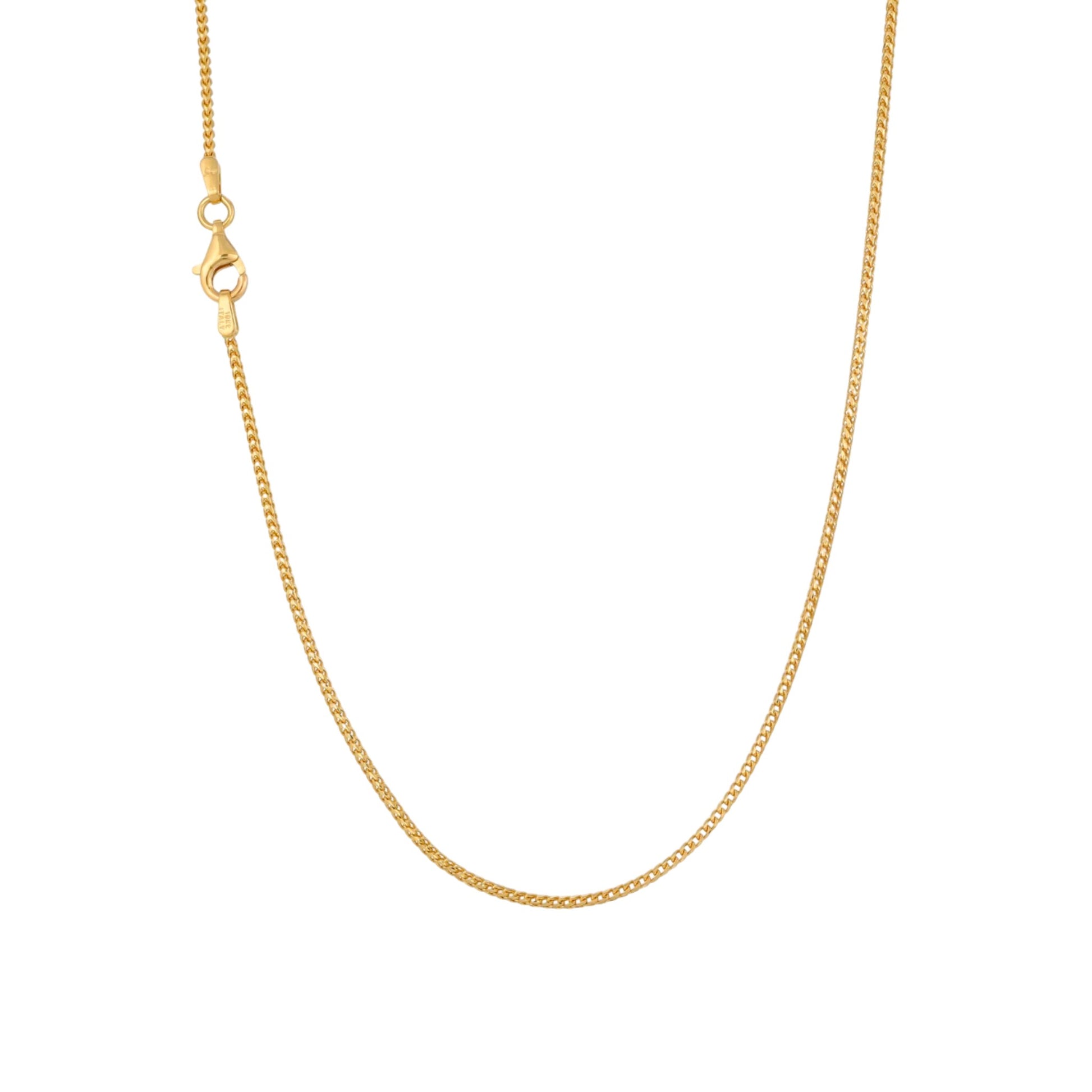 Gold chain necklace on a white background
