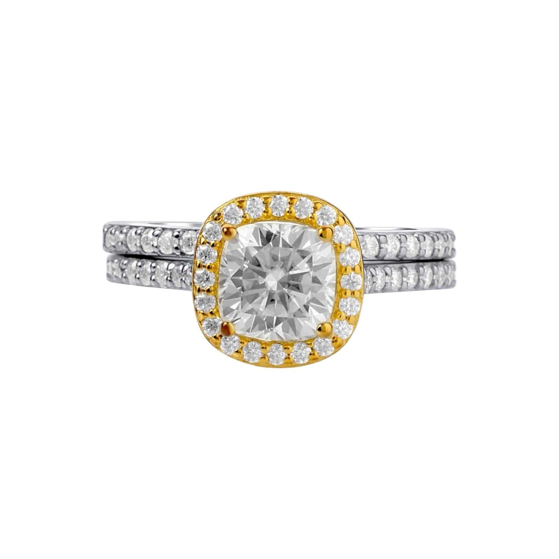 Diamond ring with gold and silver band on a white background