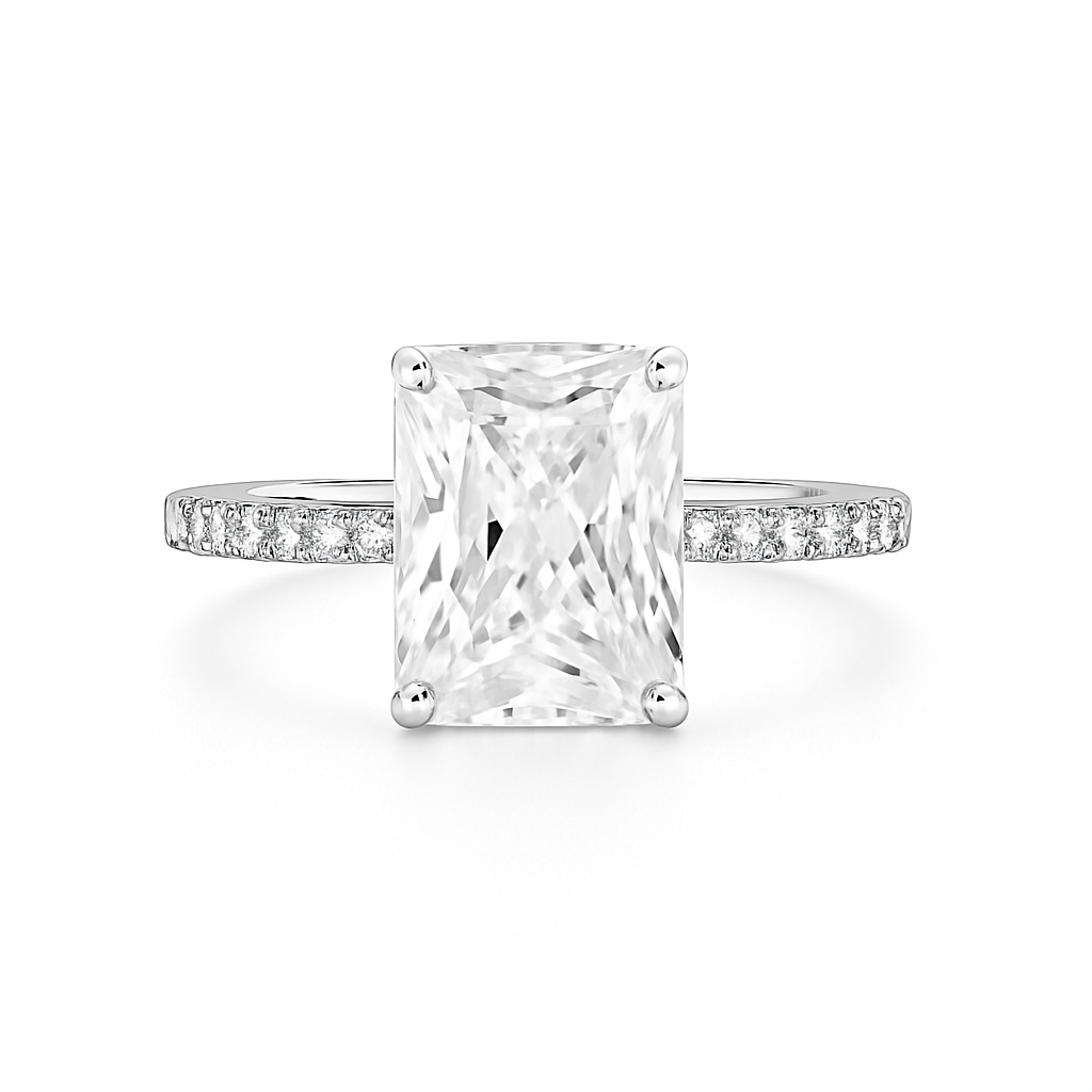 Diamond ring with a rectangular center stone on a white background