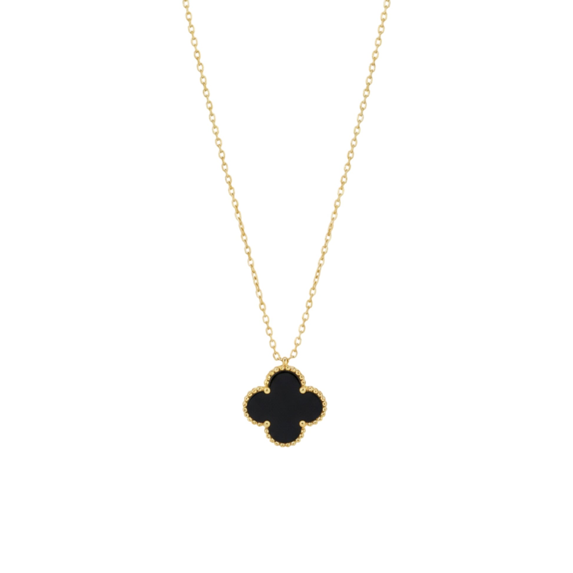 Gold necklace with a black clover pendant on a white background