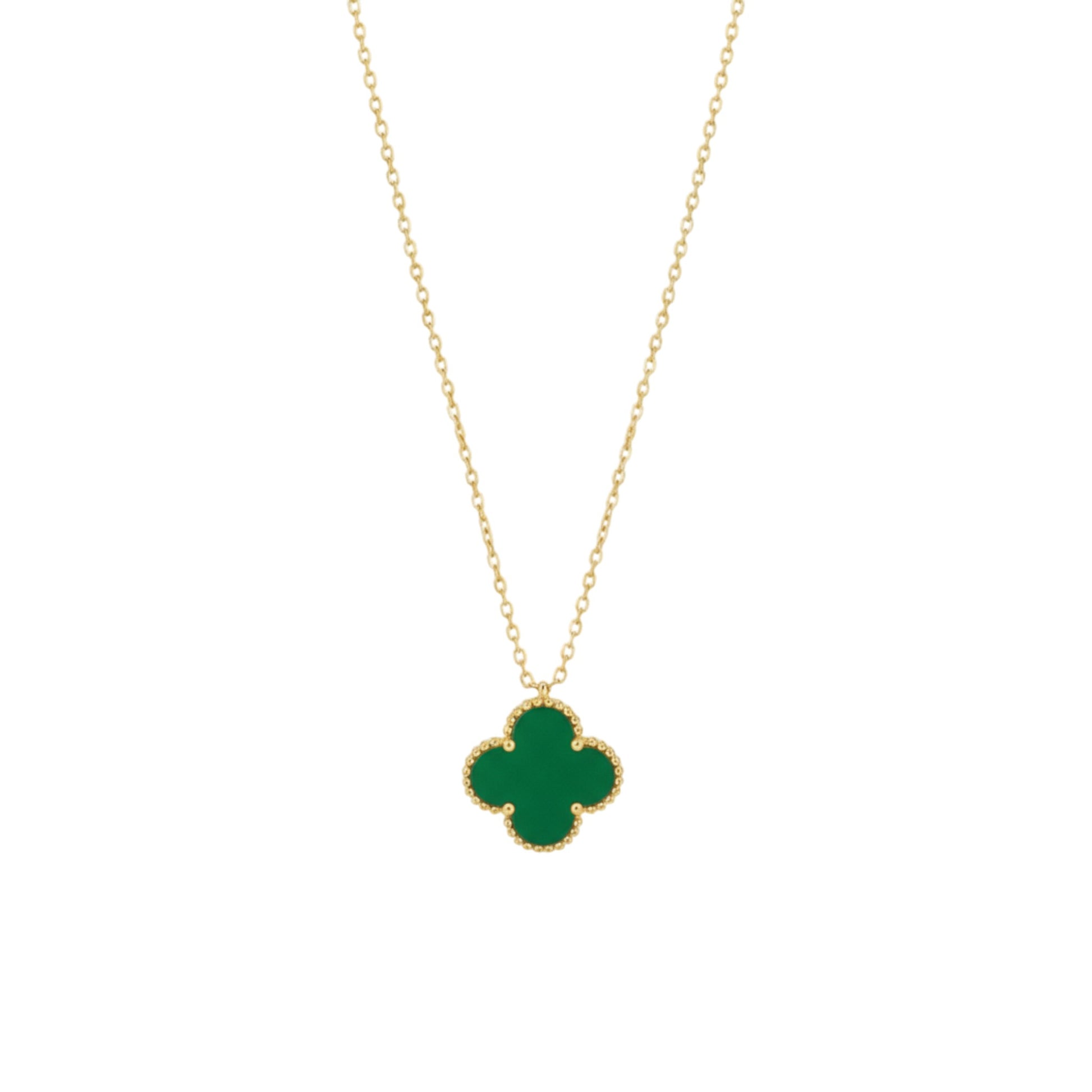 Gold necklace with a green clover pendant on a white background