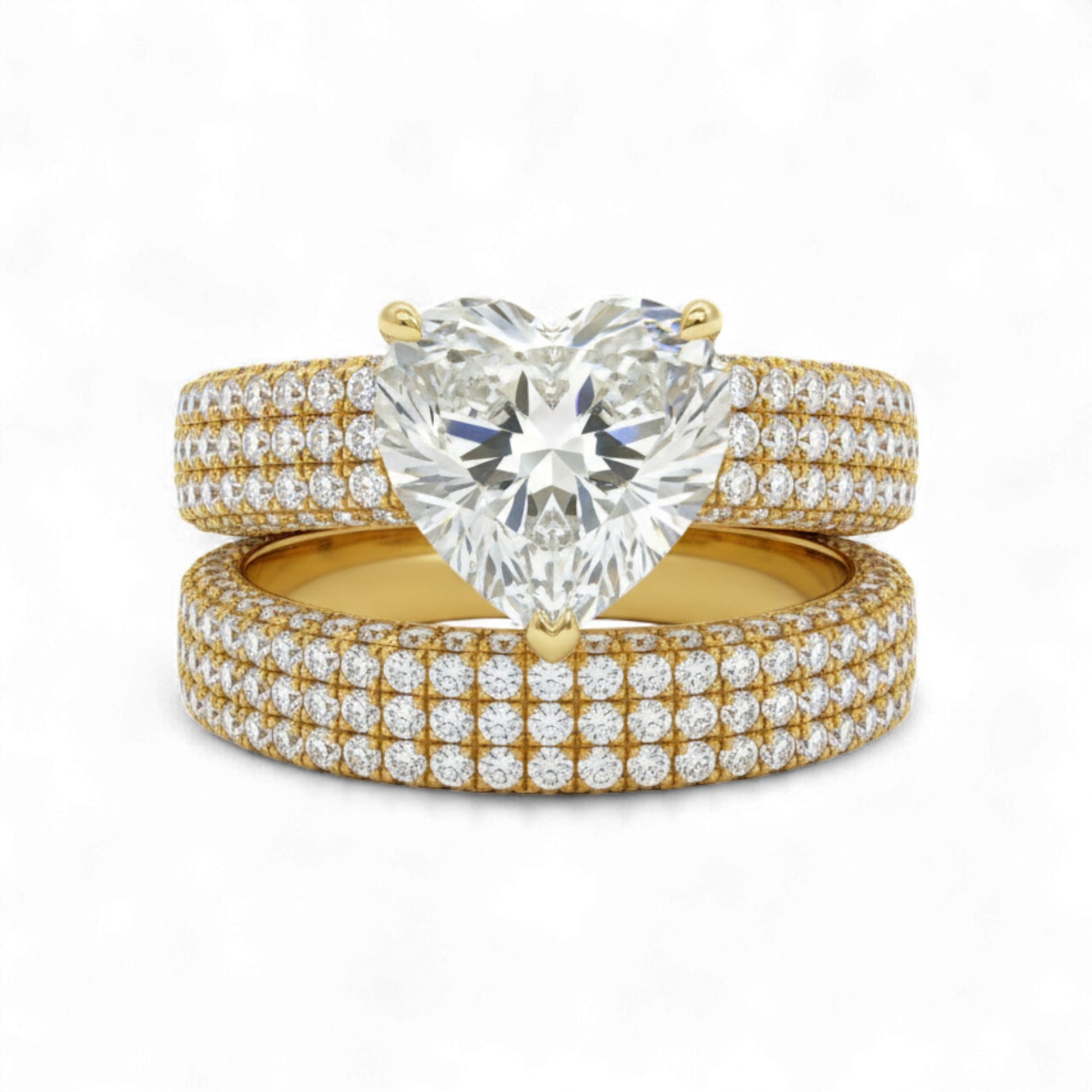 Gold and diamond ring set on a white background