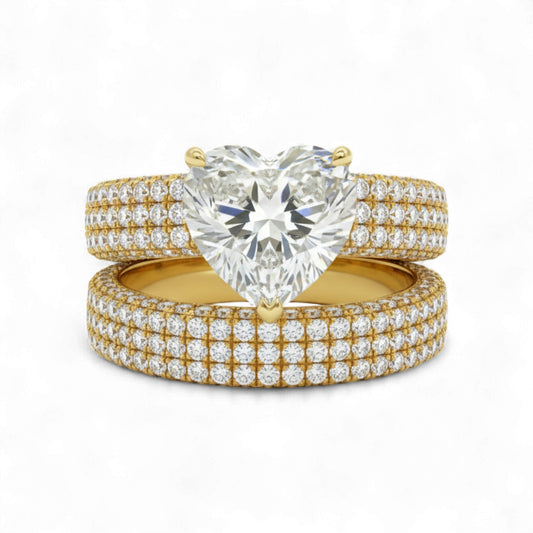 Gold and diamond ring set on a white background