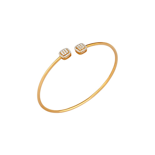 Gold bracelet with two diamond-studded ends on a white background
