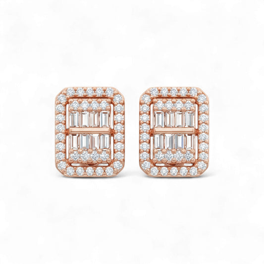 Rose gold earrings with emerald-cut gemstones and diamond accents on a white background