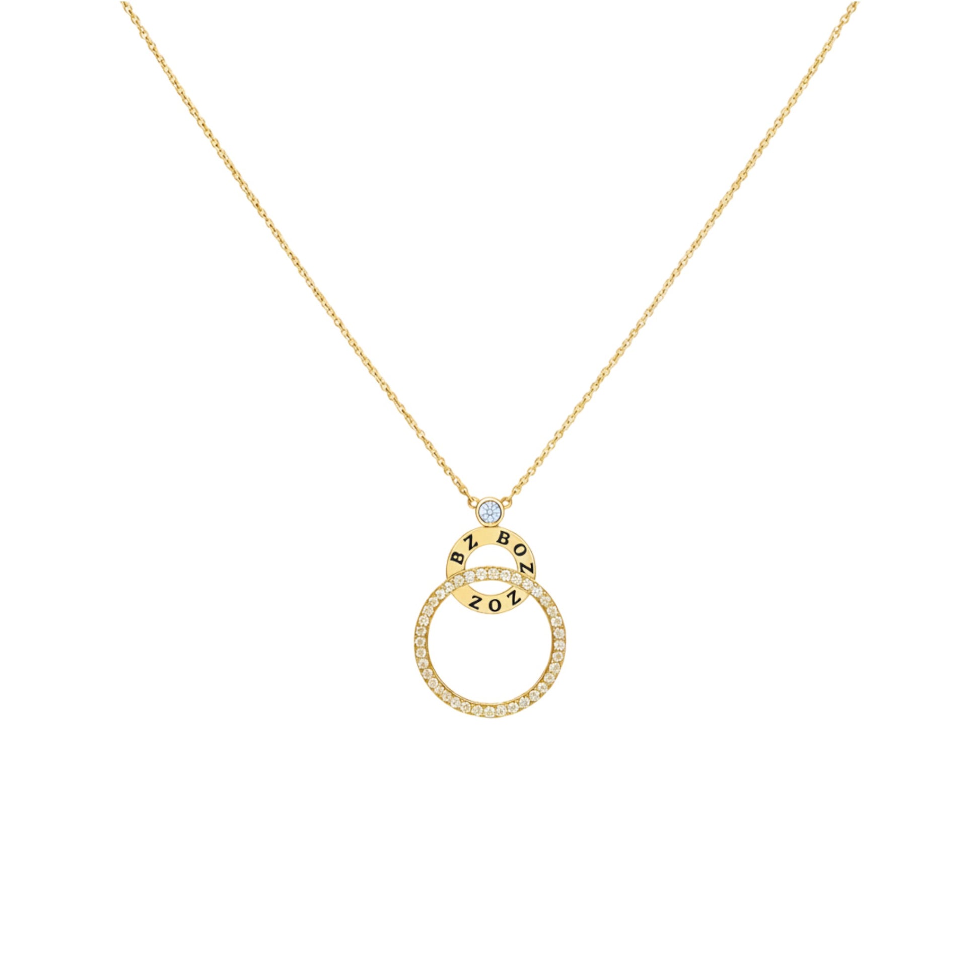 Gold necklace with a circular pendant on a white background