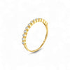 Gold ring with small diamonds on a white background