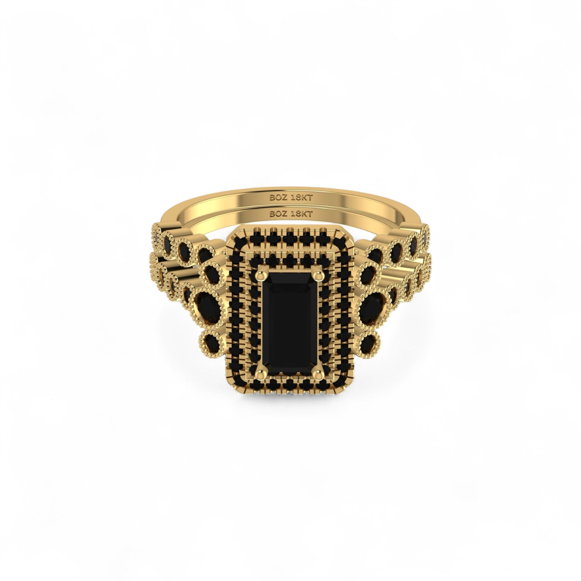 Gold ring with black gemstone on a white background
