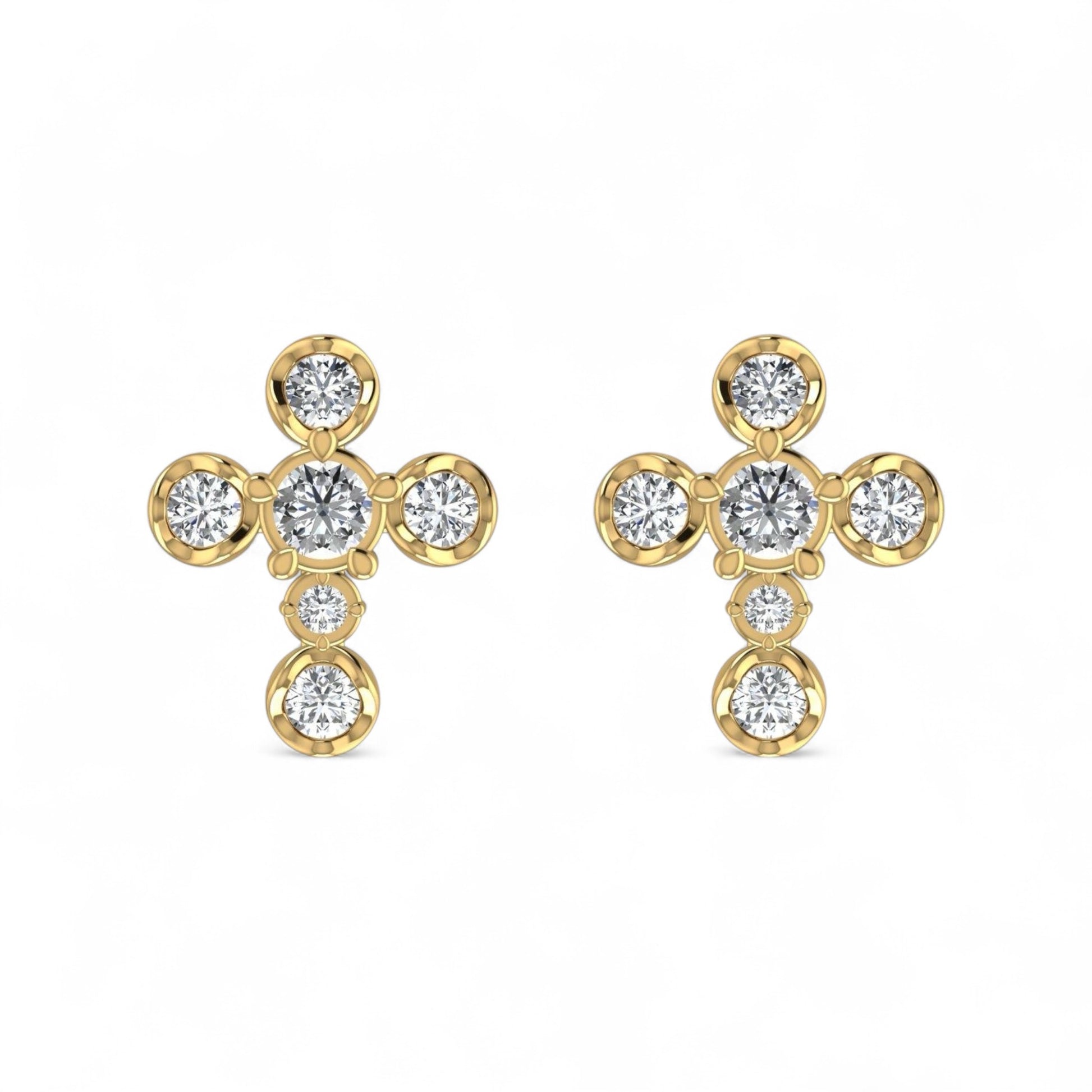 Gold earrings with clear gemstones on a white background