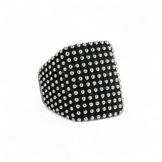 Black ring with silver studs on a white background
