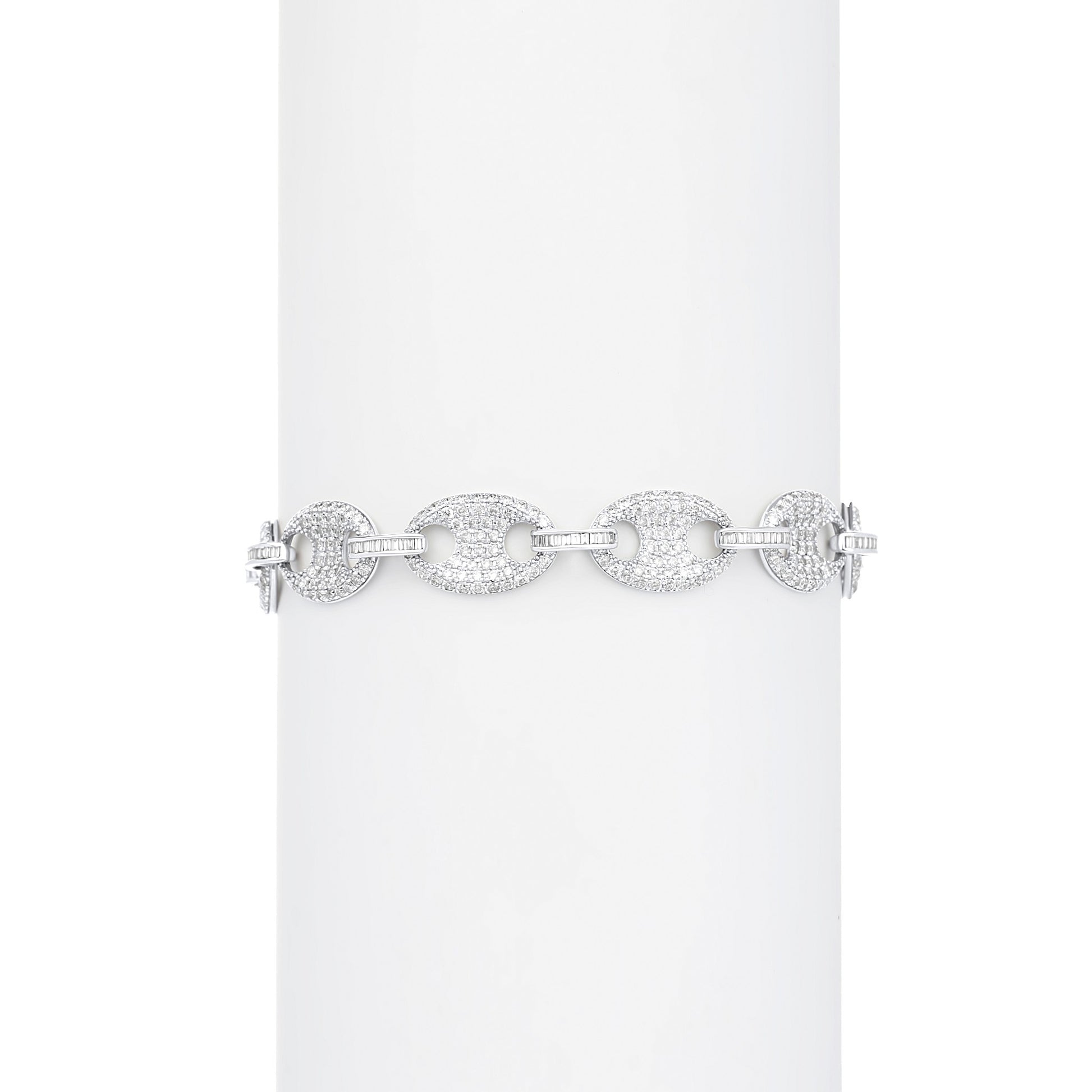 Silver bracelet with circular links on a white background
