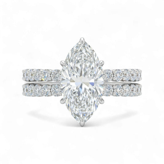 Diamond ring with pear-shaped center stone on a white background