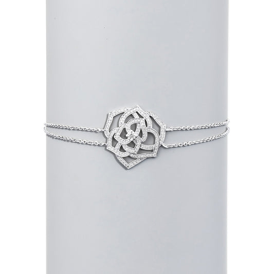 Silver bracelet with a decorative clasp on a light gray background