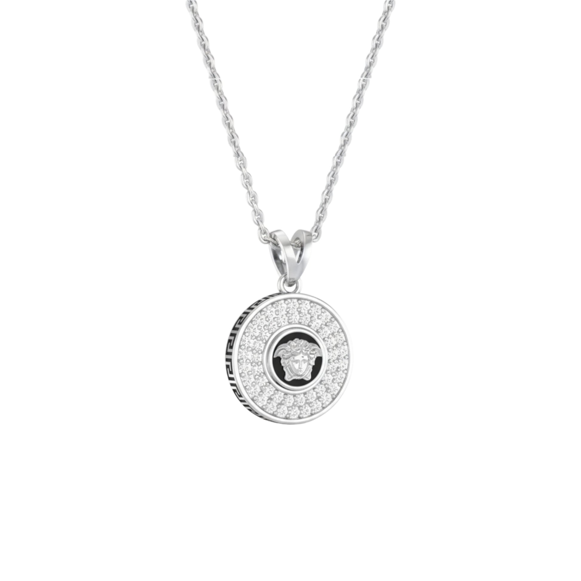 Silver necklace with a round pendant on a white background