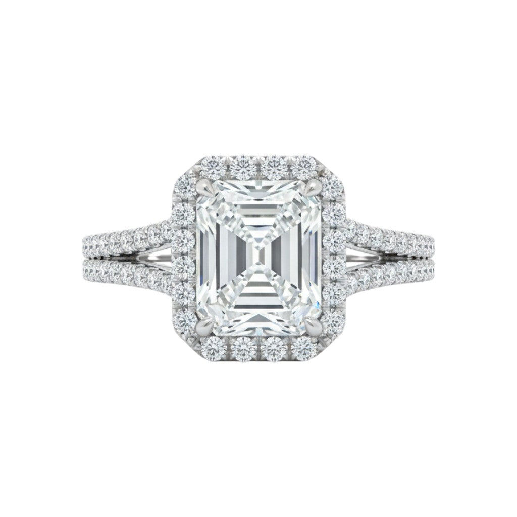 Diamond ring with emerald-cut center stone on a white background