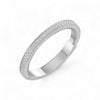 Silver ring with textured band on a white background