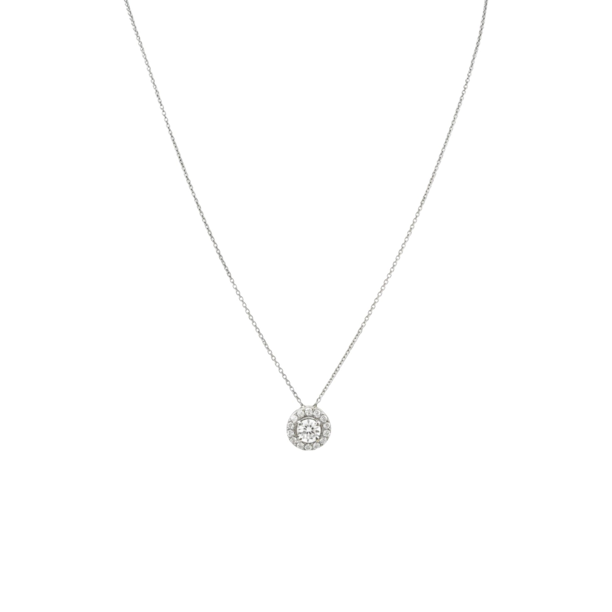 Silver necklace with a round pendant on a white background