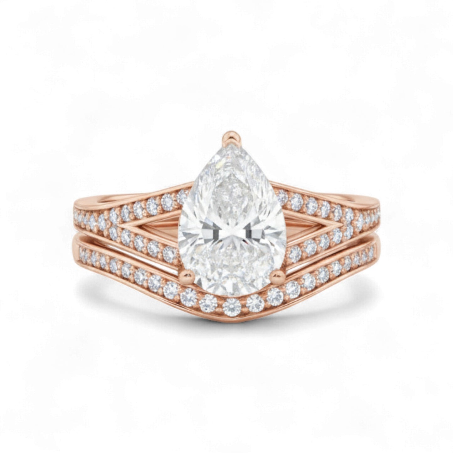 Rose gold ring with a pear-shaped diamond on a white background