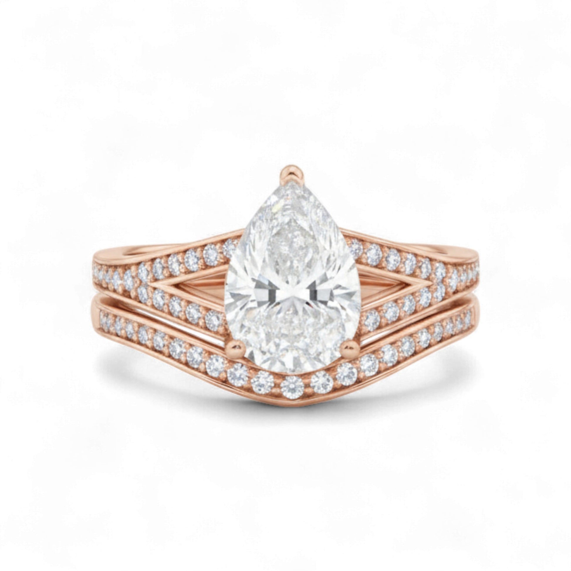 Rose gold ring with a pear-shaped diamond on a white background
