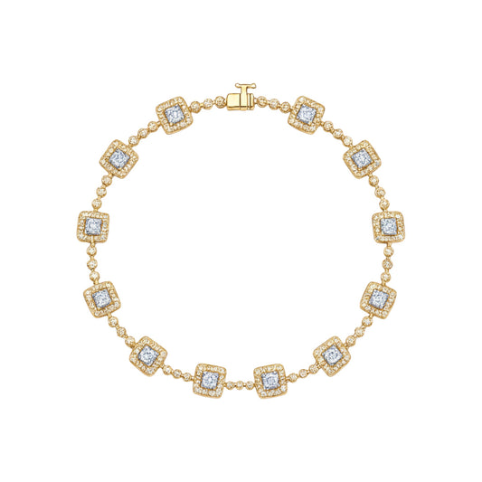Gold bracelet with diamond accents on a white background