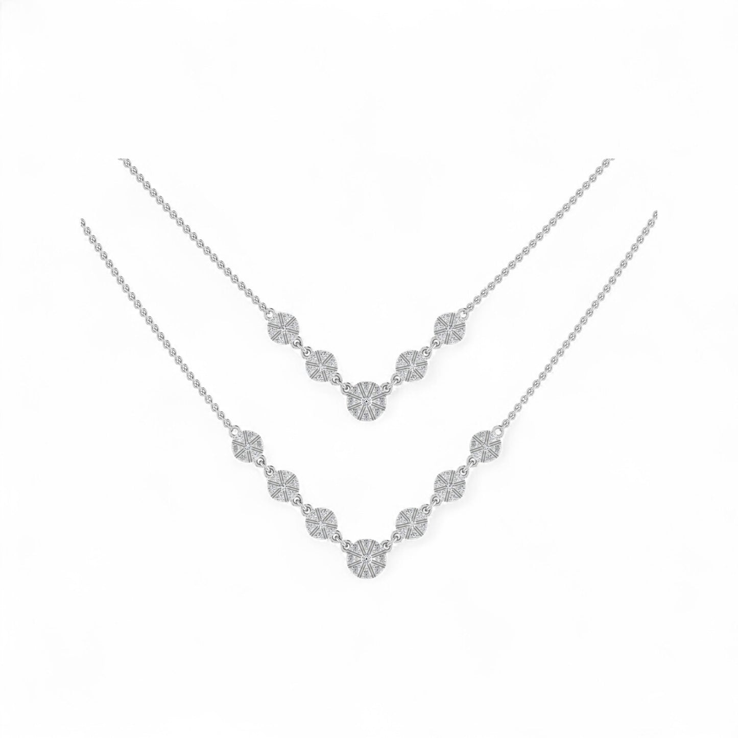 Silver necklace with floral design on a white background