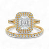 Gold ring with emerald-cut center stone and diamond halo on a white background