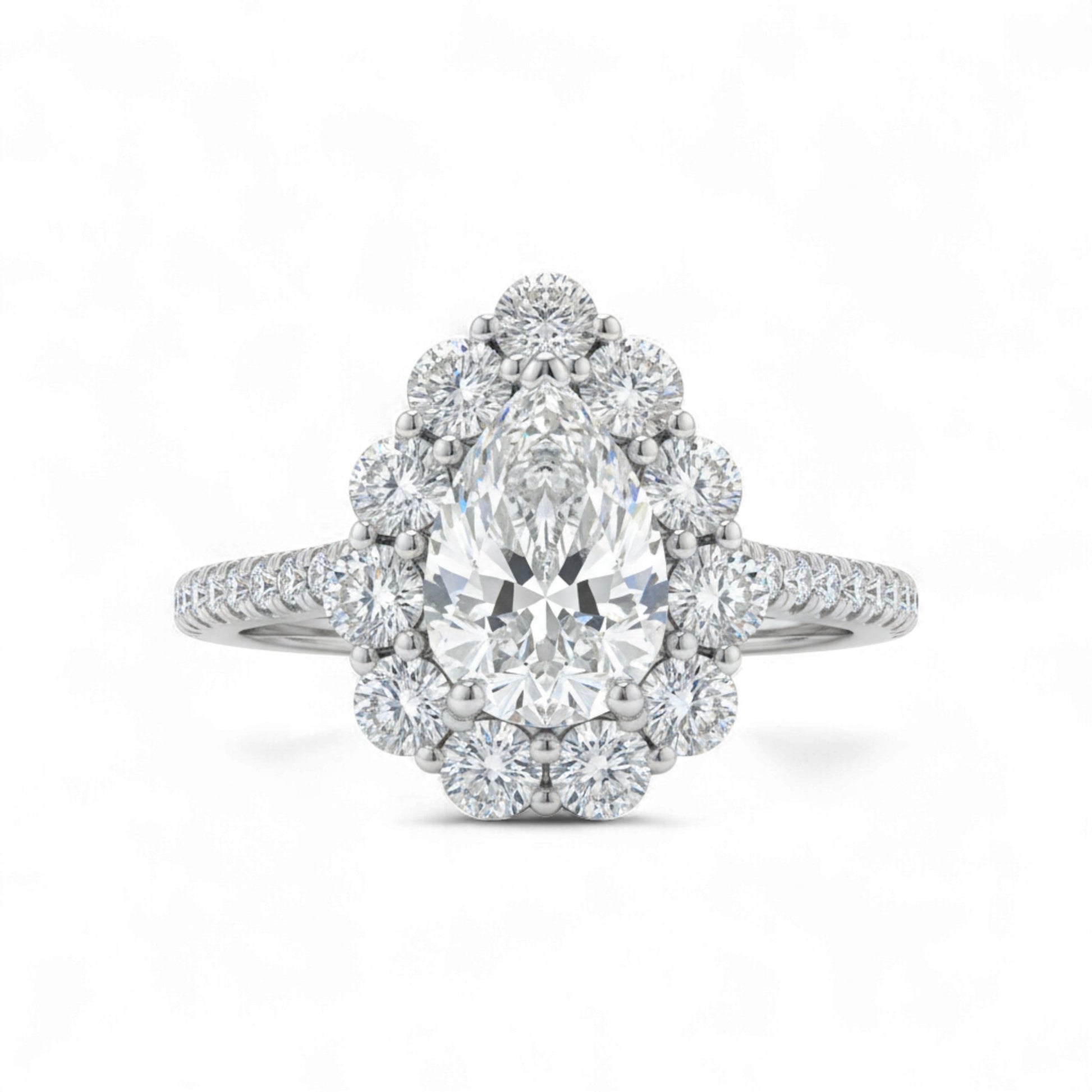 Diamond ring with a pear-shaped center stone on a white background