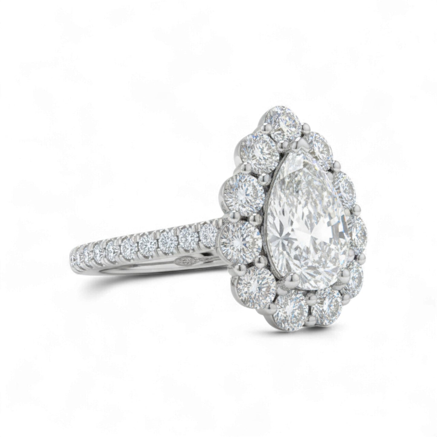 Diamond ring with a pear-shaped center stone on a white background