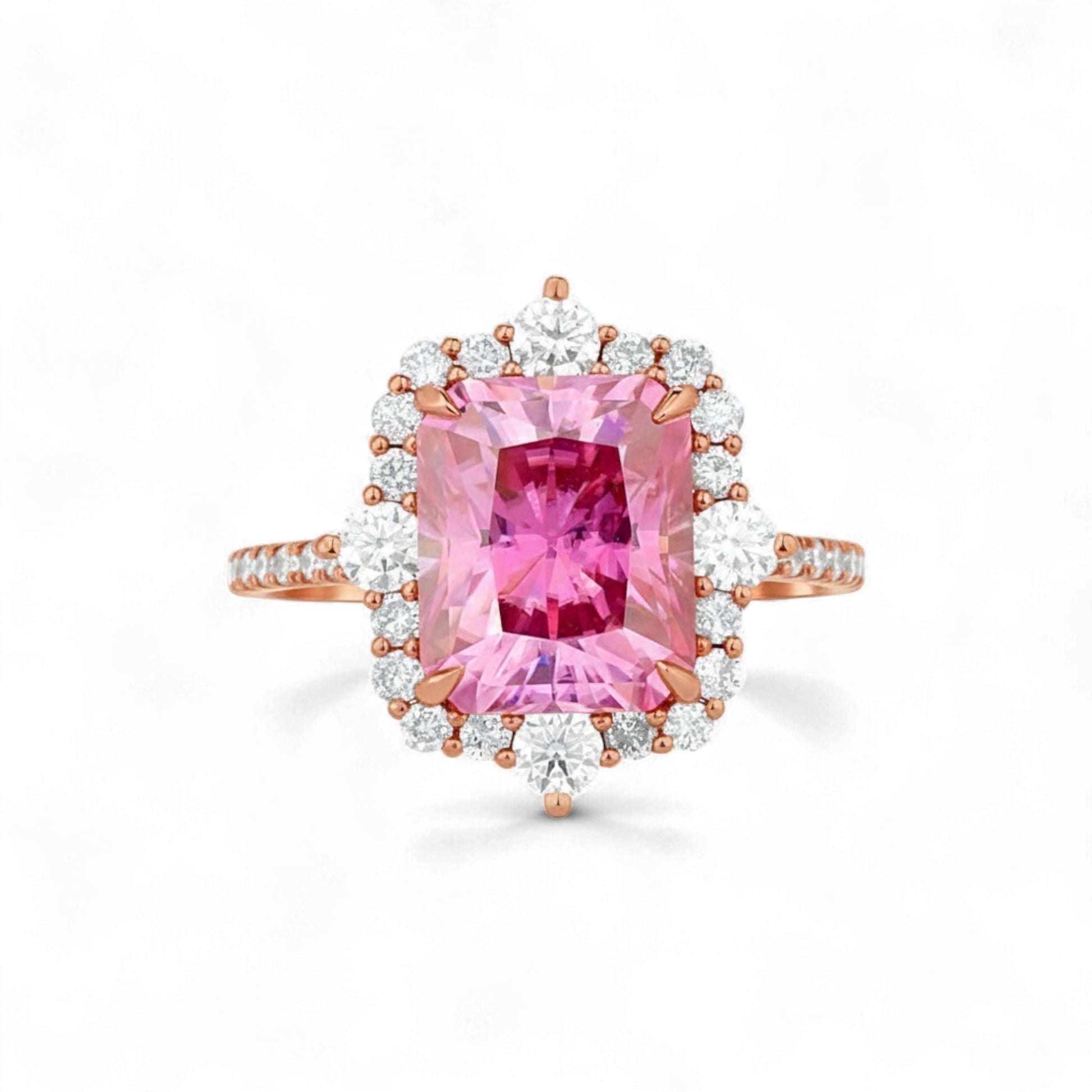 Ring with a pink gemstone and rose gold accents on a white background