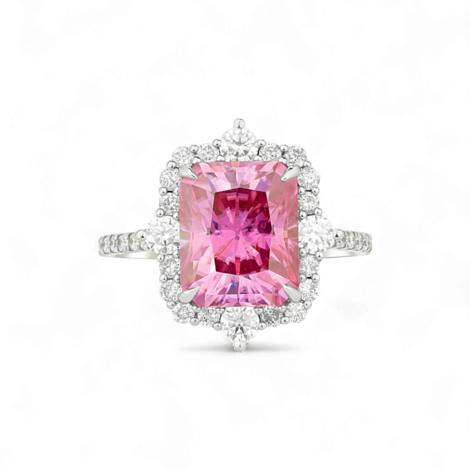 Ring with a pink gemstone and diamond accents on a white background