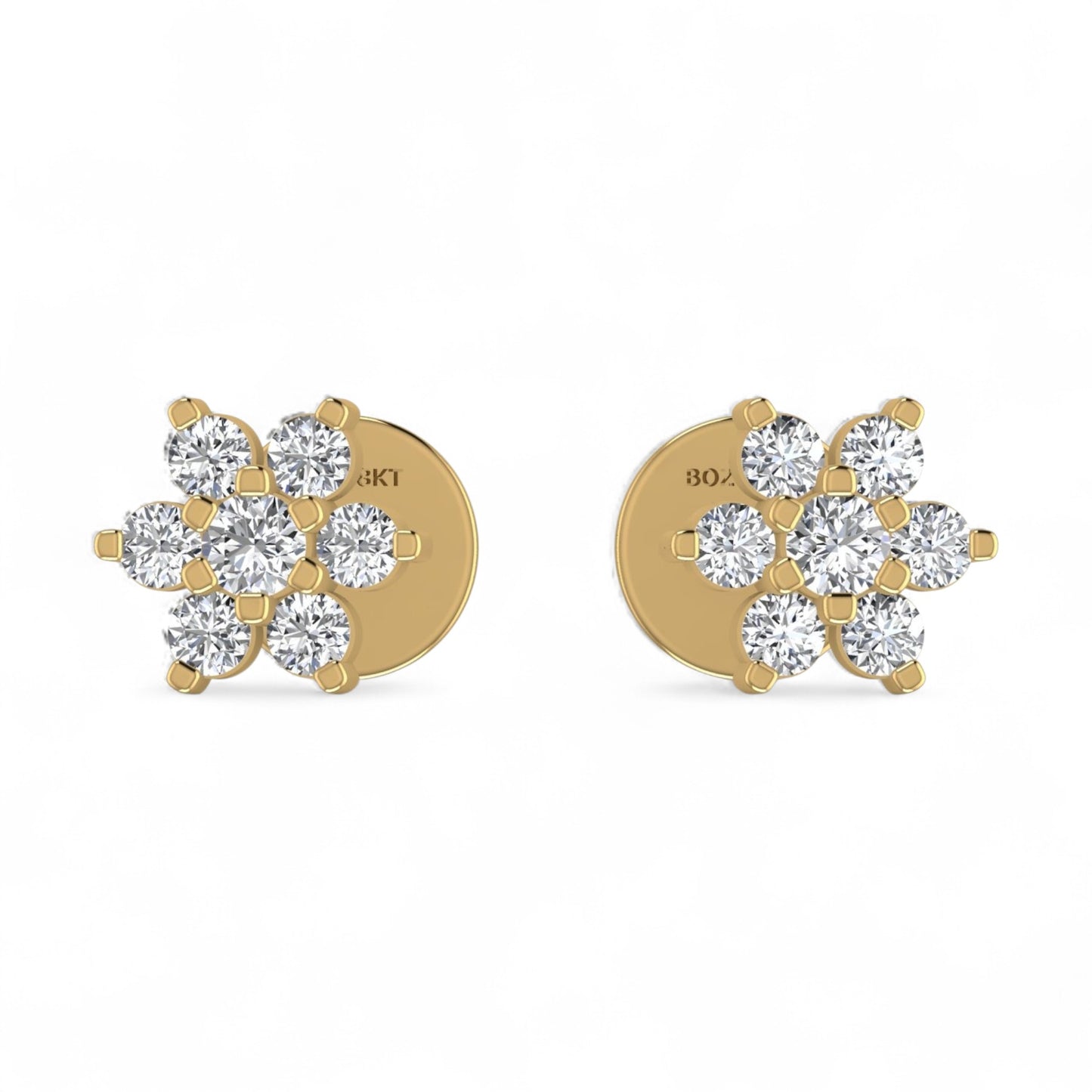 Gold earrings with diamond-like stones on a white background