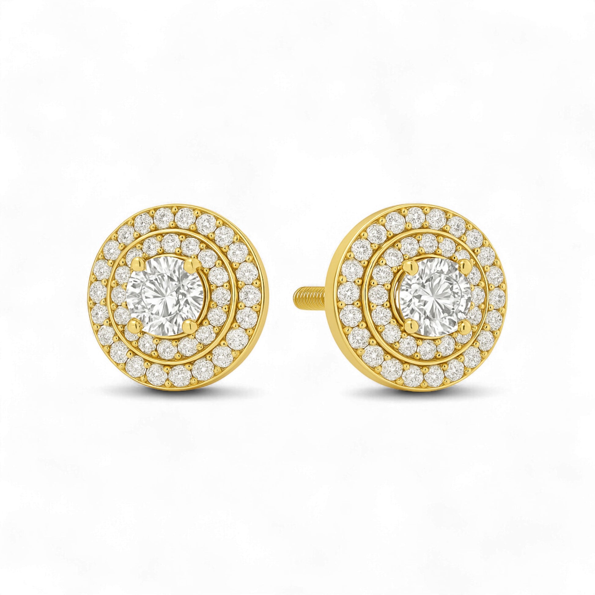 Gold and diamond earrings on a white background