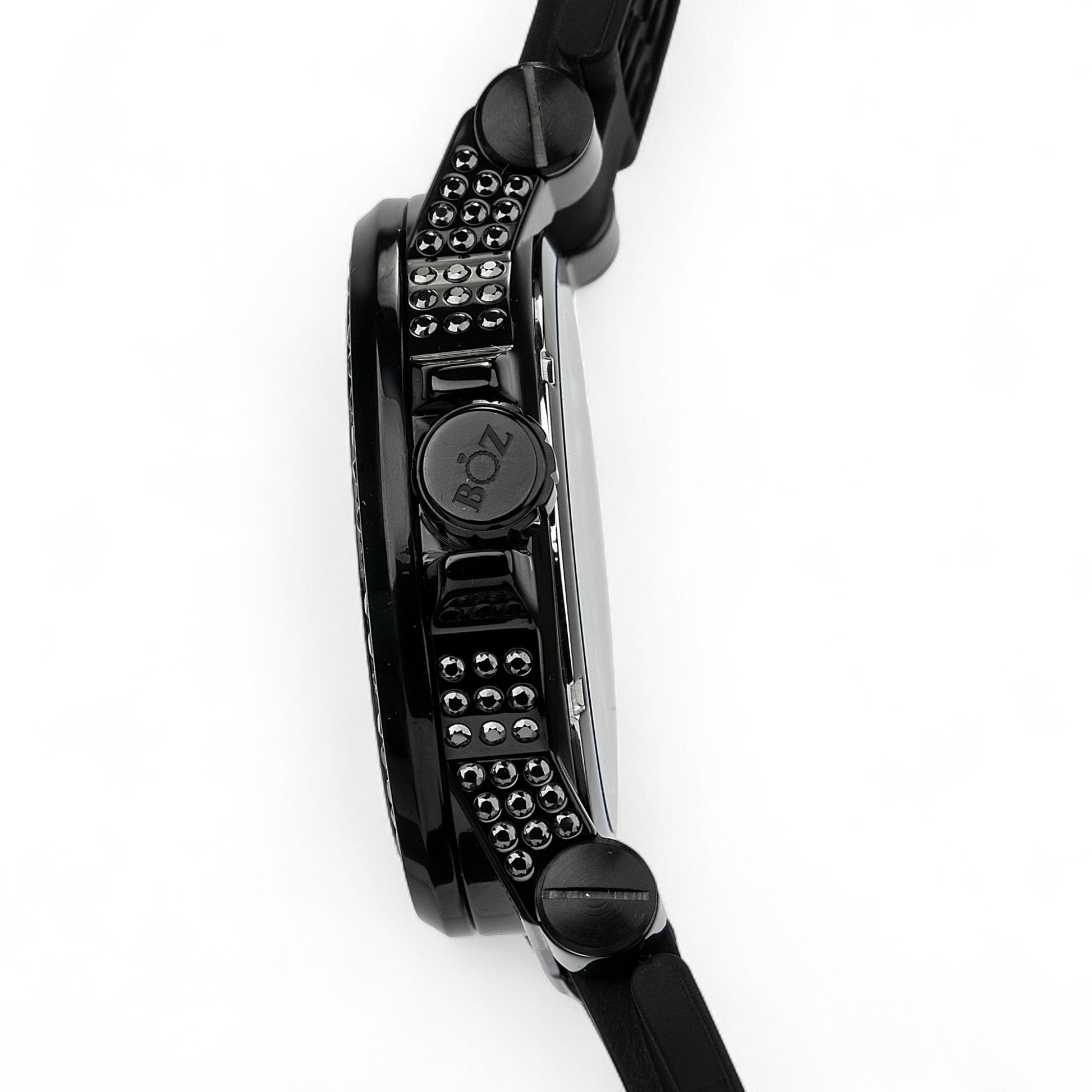 Close-up of a black wristwatch with detailed design on a white background