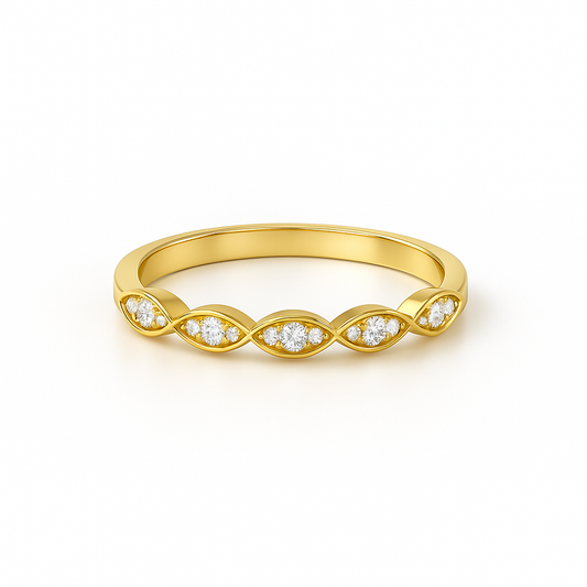 Gold ring with diamond accents on a white background