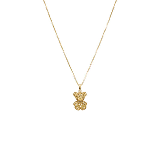 Gold teddy bear pendant necklace on a white background
