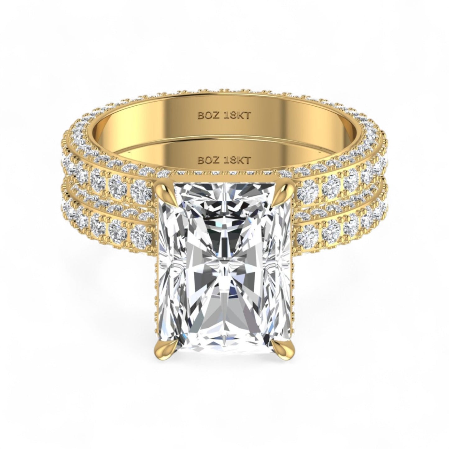 Gold ring with a large diamond and smaller diamonds on the band against a white background