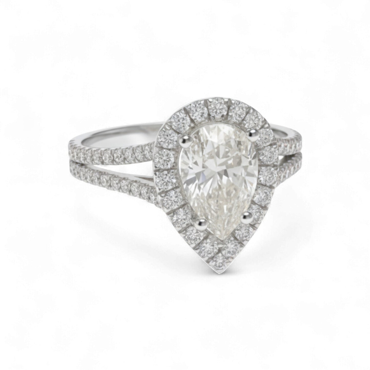 Diamond ring with pear-shaped center stone on a white background