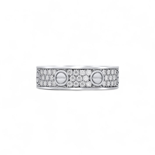 Silver ring with embedded diamonds on a white background