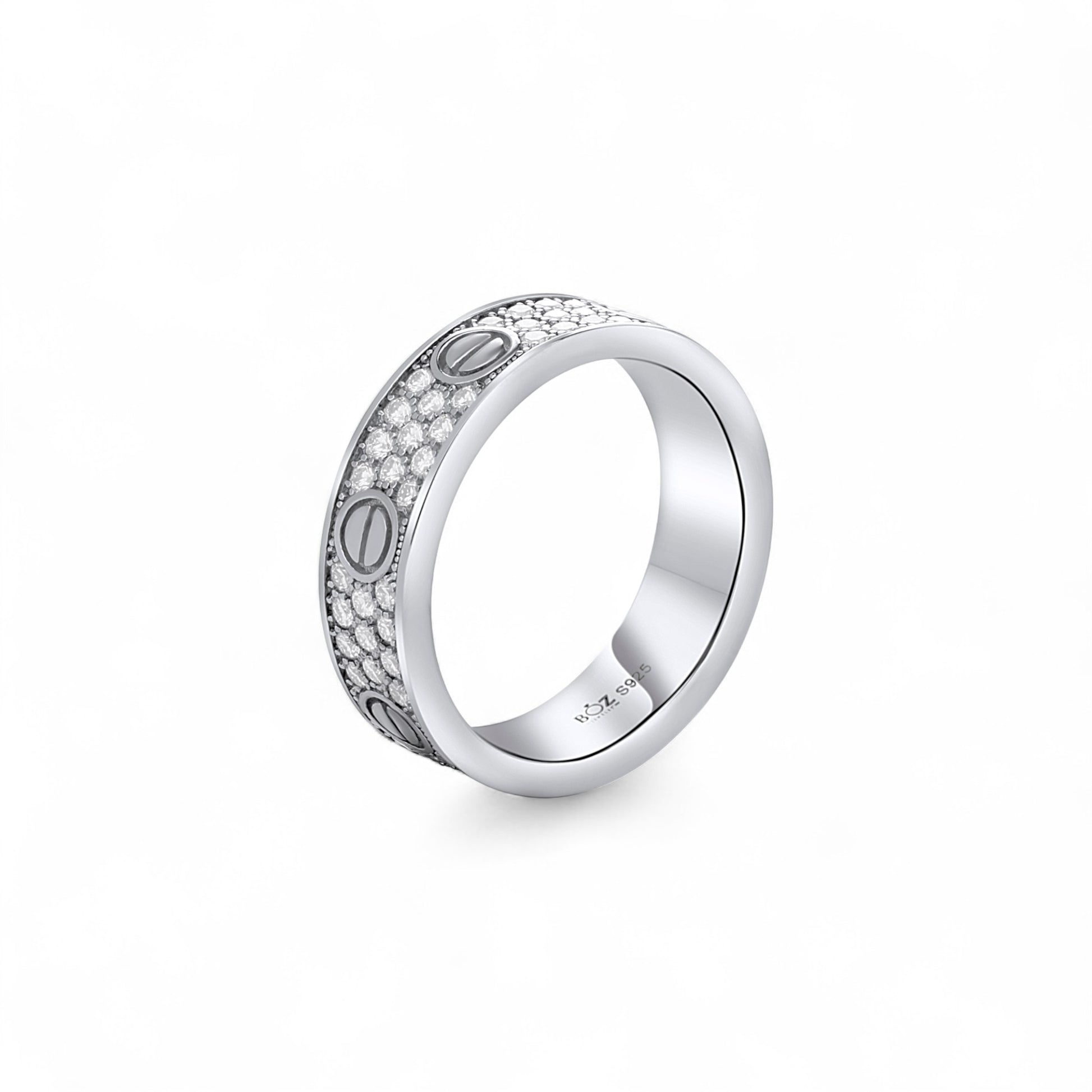 Silver ring with engraved design on a white background