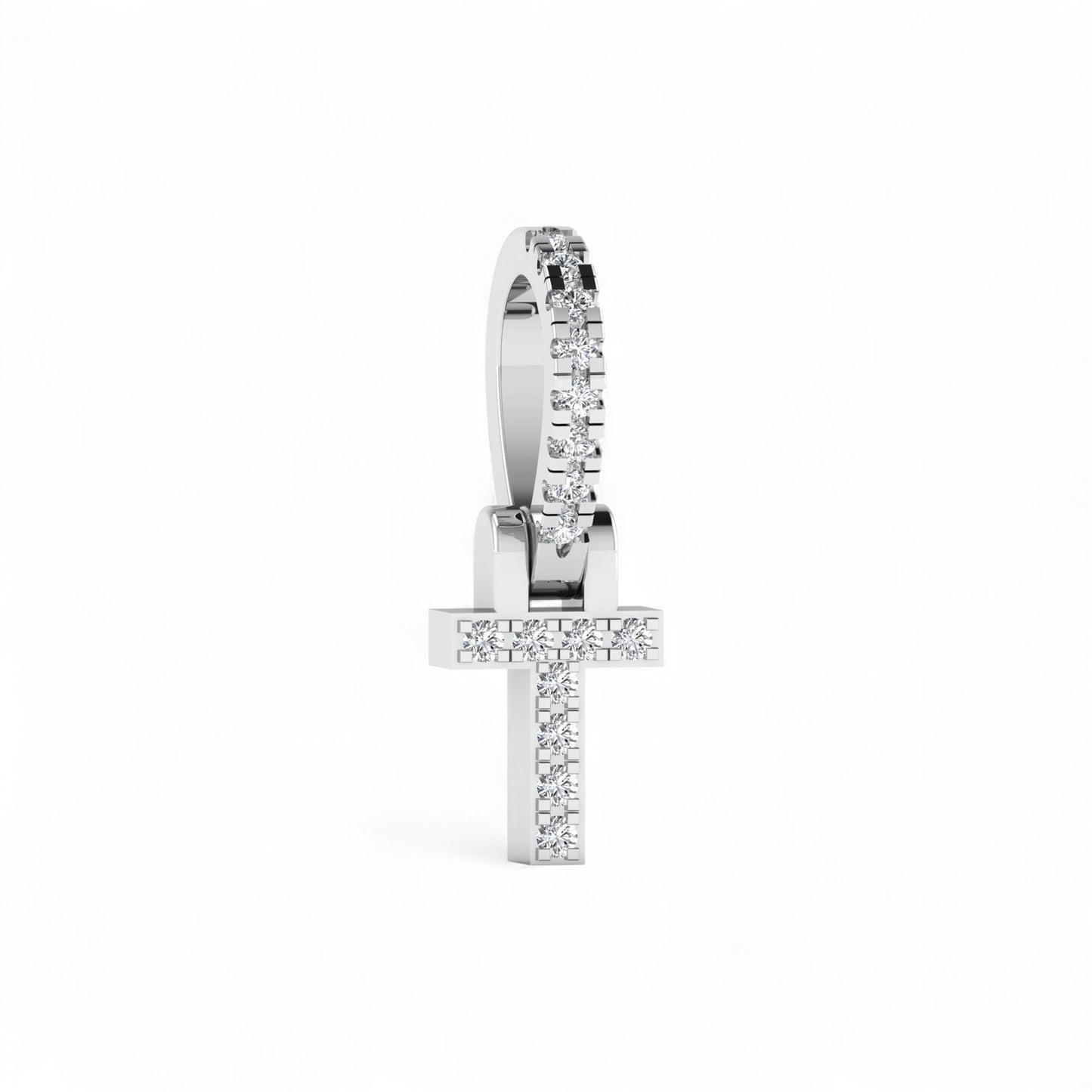 Silver cross-shaped earring with clear stones on a white background