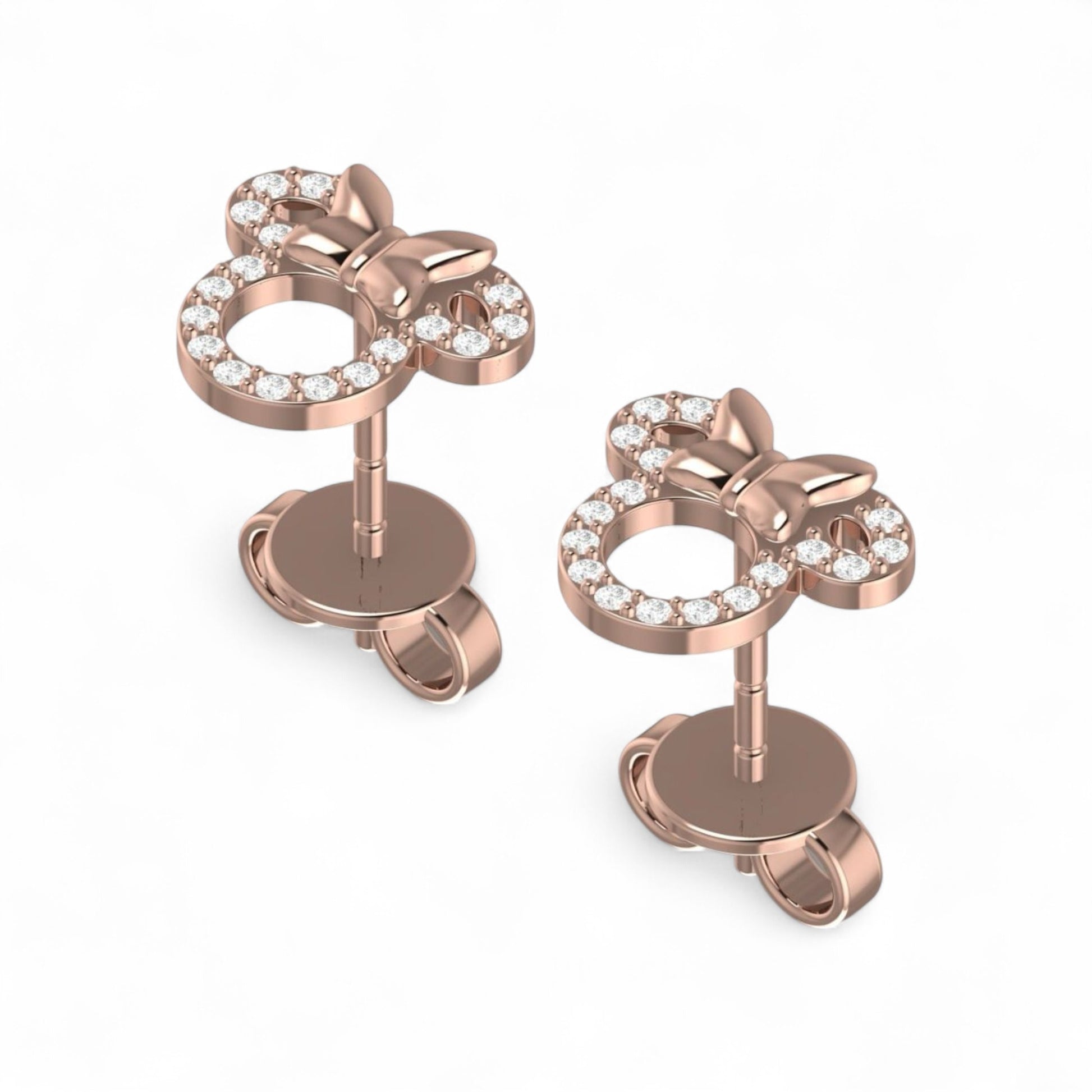 Rose gold earrings with star designs and clear gemstones on a white background