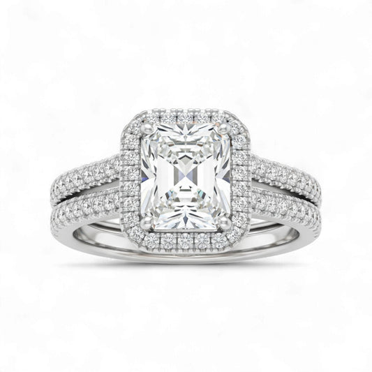 Diamond ring with a rectangular center stone on a white background