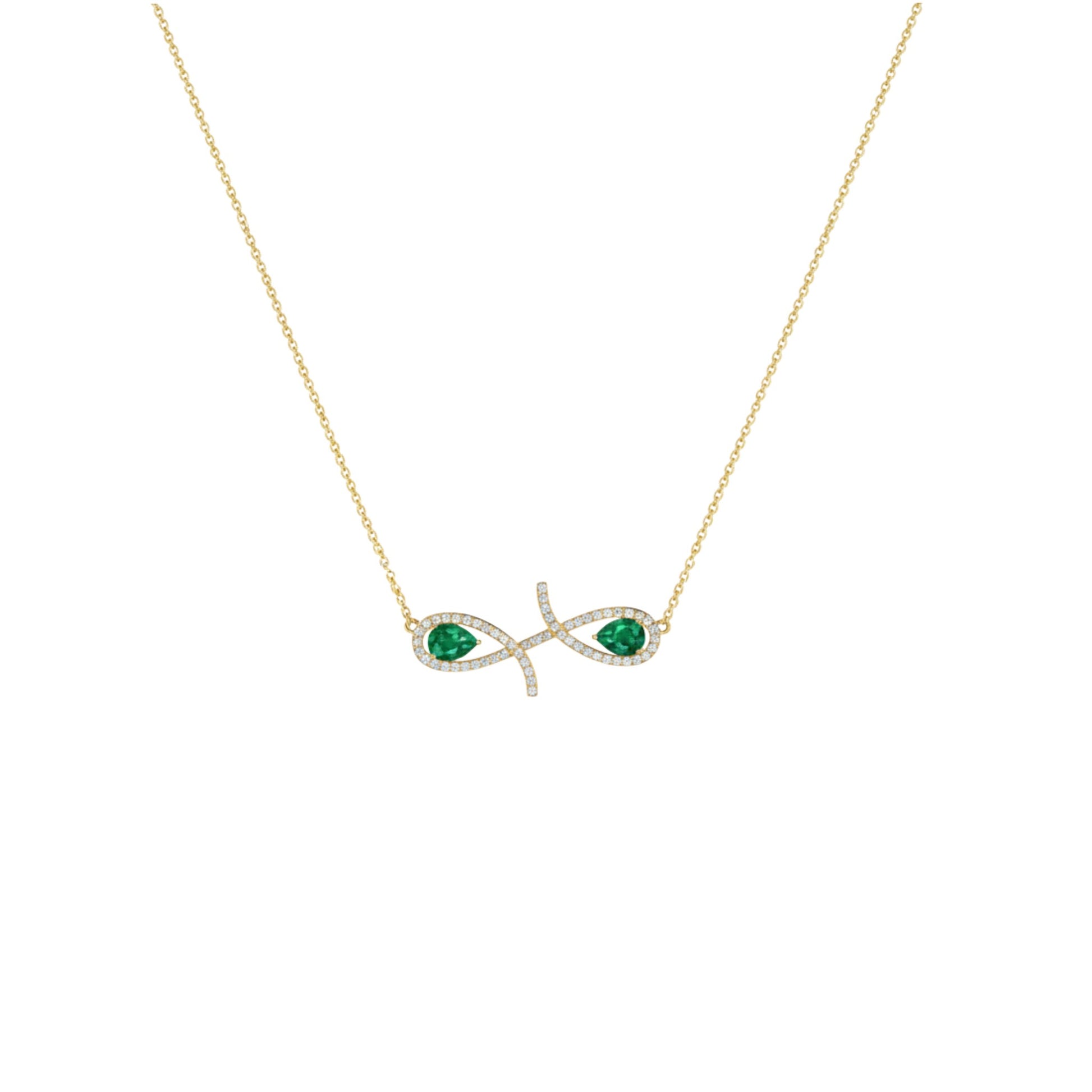 Gold necklace with emerald green gemstones on a white background